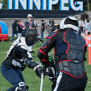 Participants playing a game of fencing