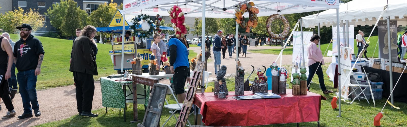 vendor under a sponsorship tent